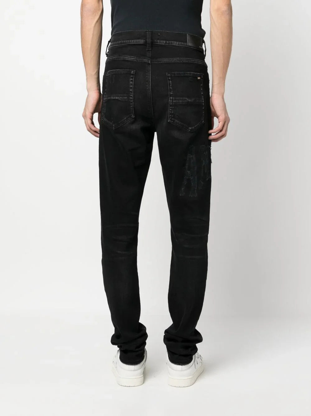 AMIRI skinny jeans con logo bordado